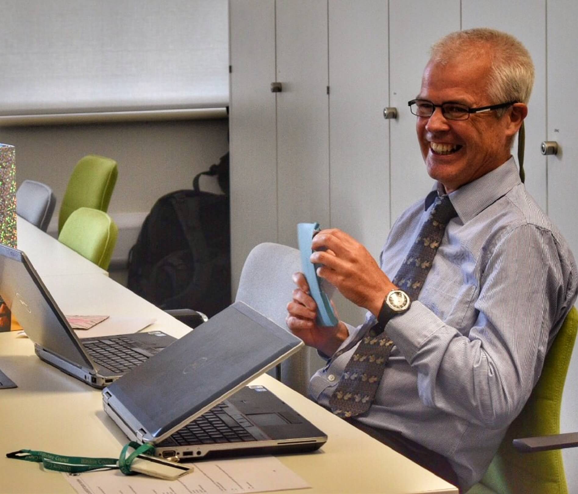 Person smiling at desk